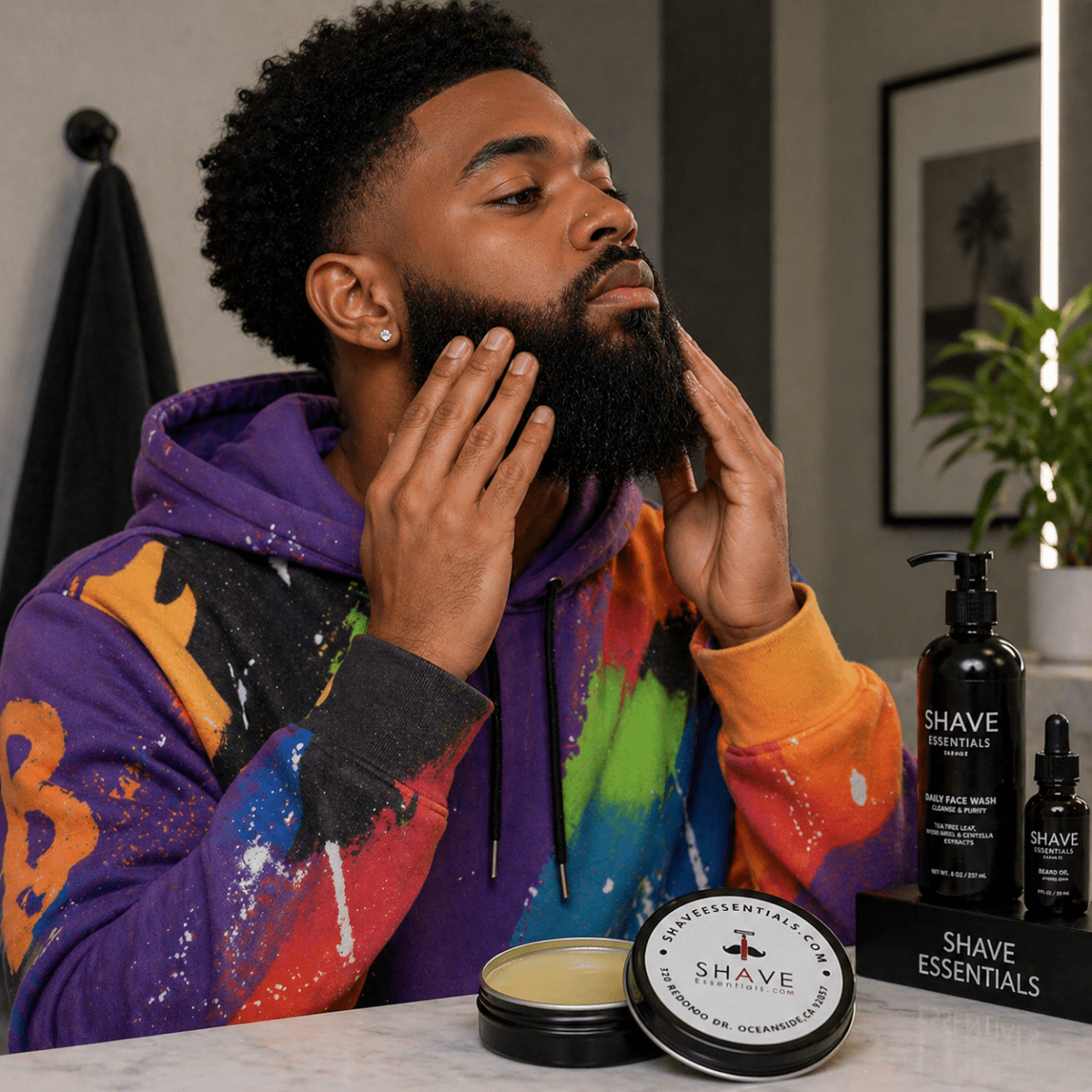 Beard balm tins on counter beside man applying balm to beard