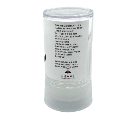 Mineral deodorant stick with back text label on clear container and screw-top cap