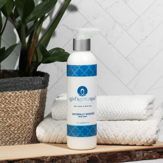 Body lotion bottle with silver pump and blue patterned label