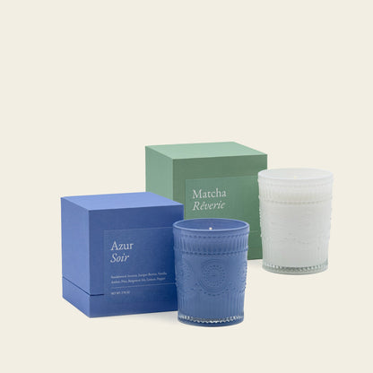 Scented glass candles with blue and green jars and matching gift boxes