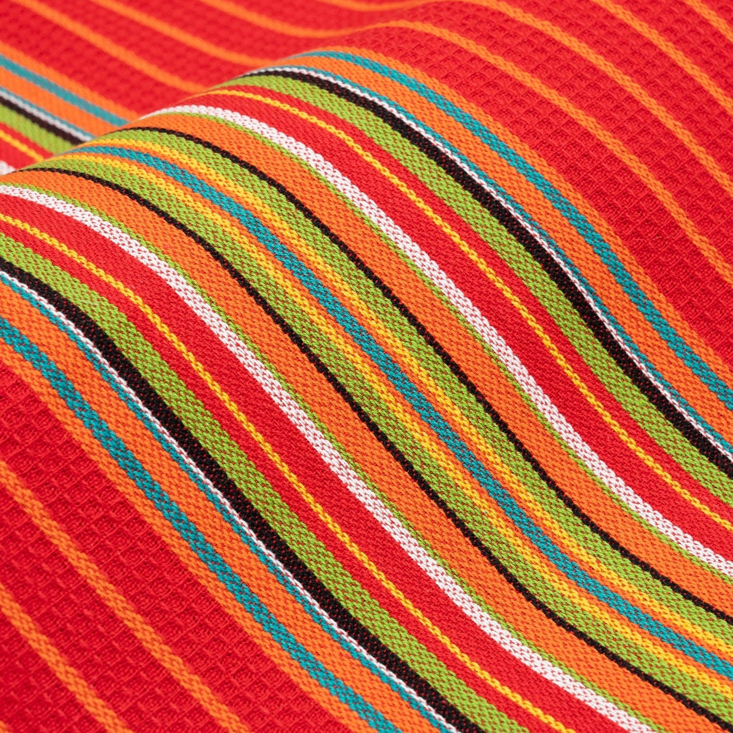 Striped kitchen towel fabric close-up in red, orange, green, blue, and white