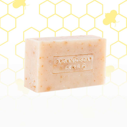 Organic bar soap, pale beige bar with tiny specks and embossed label.