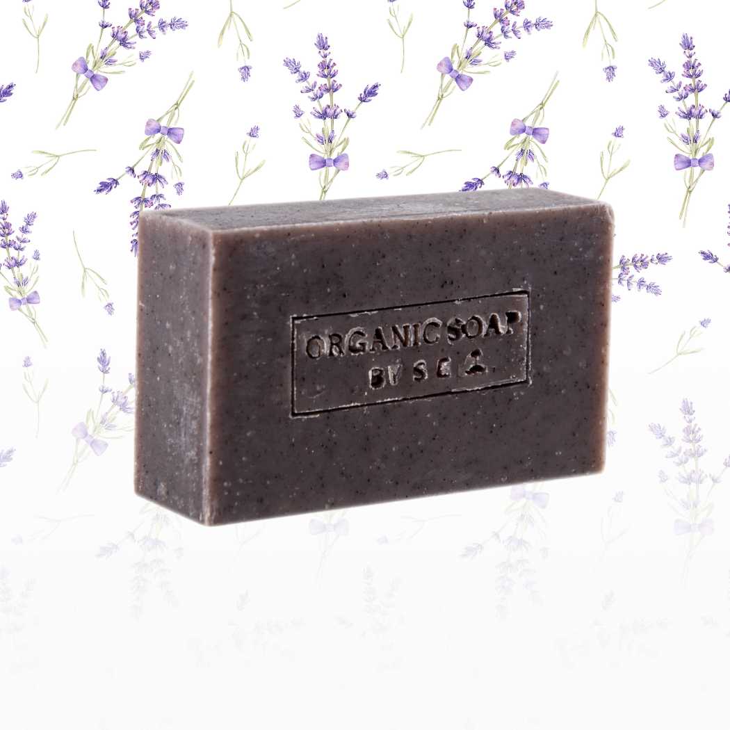 Organic bar soap, dark brown bar with embossed label and textured finish.