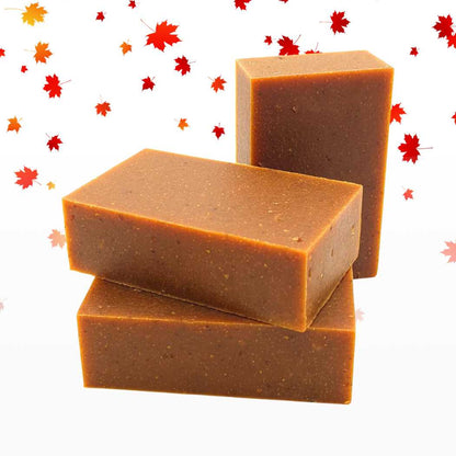 Organic bar soap, orange rectangular bars with textured surface and embossed label.