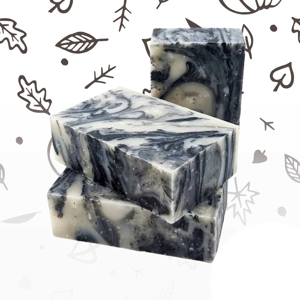 Organic bar soap, marbled dark blue-gray bar with embossed label.