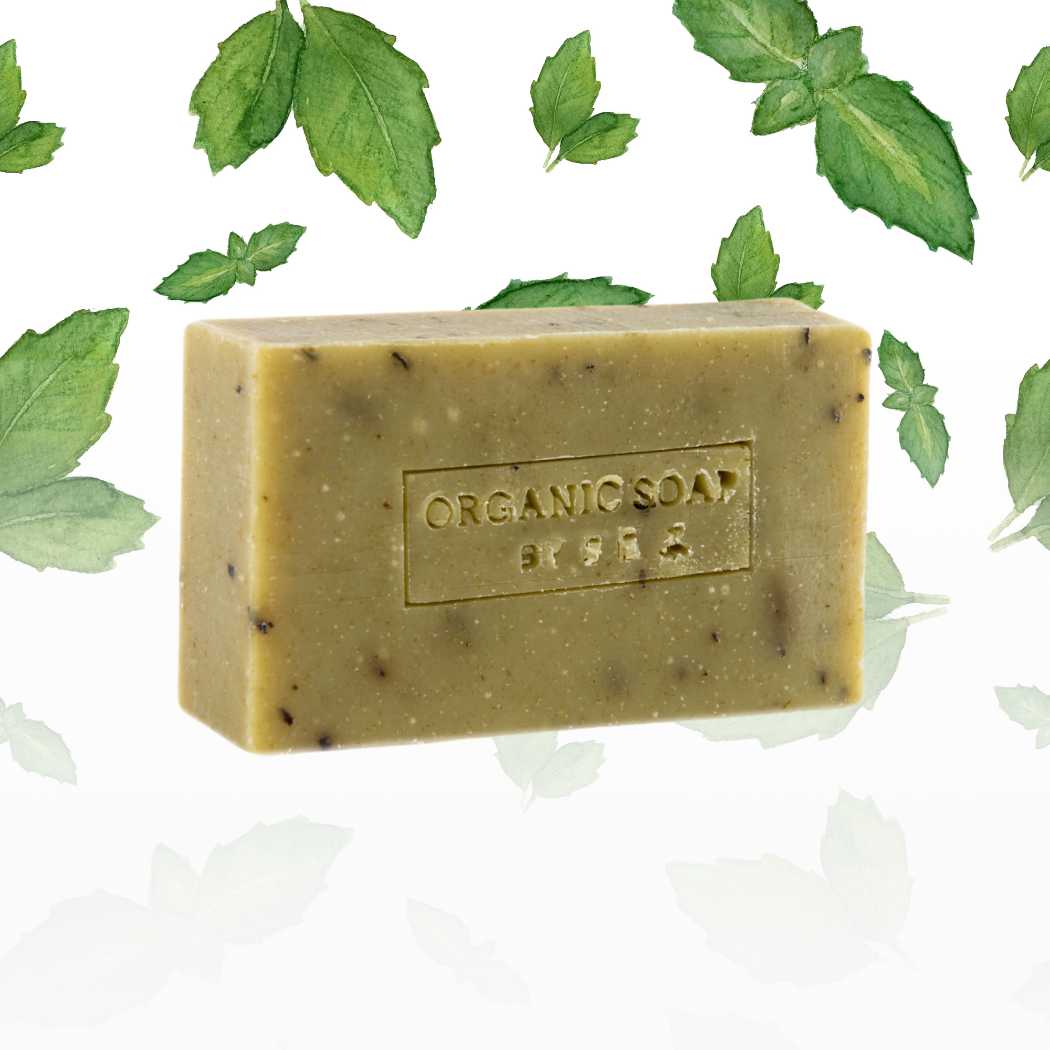 Organic bar soap, sage green bar with speckles and embossed label.