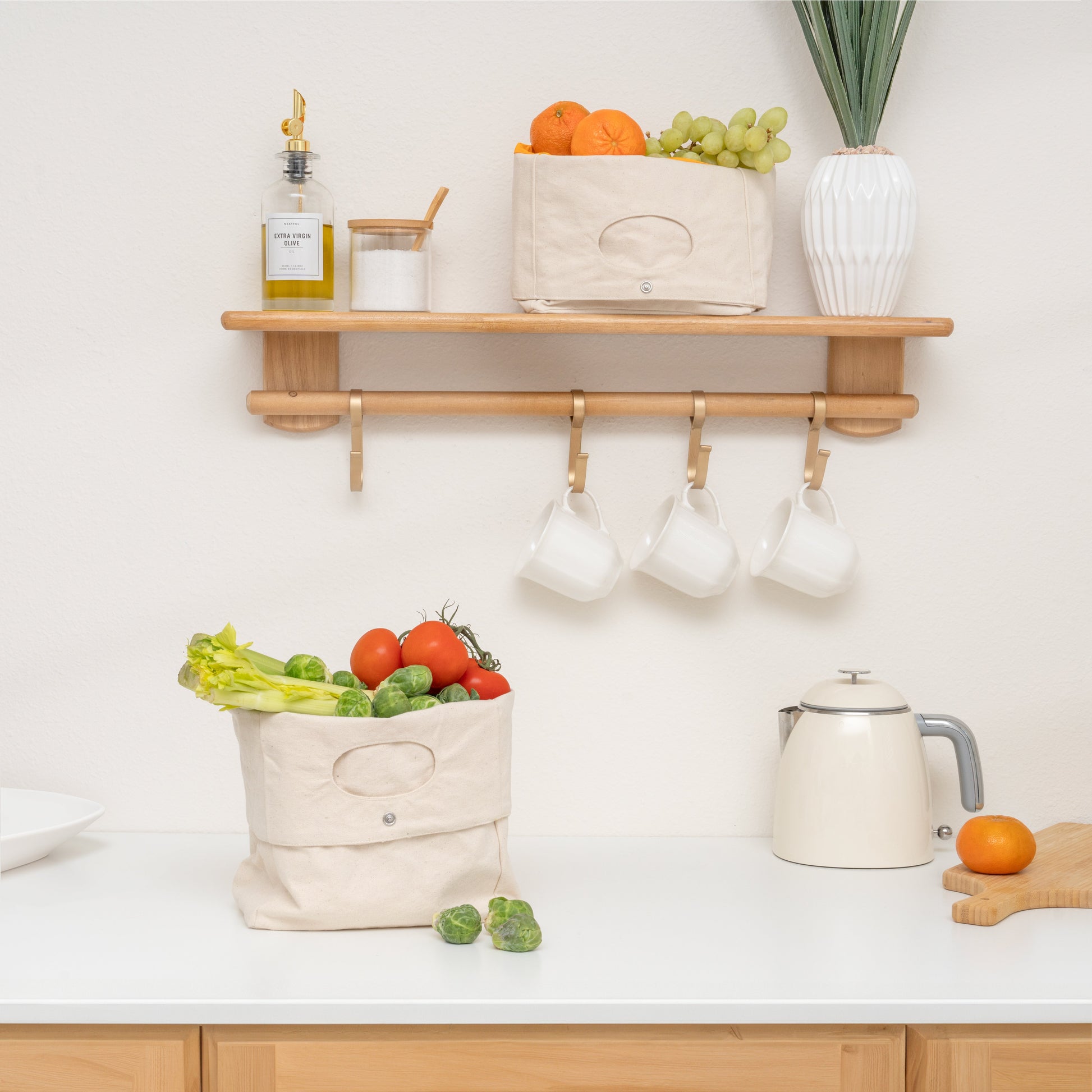 Light-beige canvas storage basket with oval front cutout and button closure