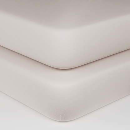 Natural cotton baby crib fitted sheet, corner seam and smooth fabric close-up