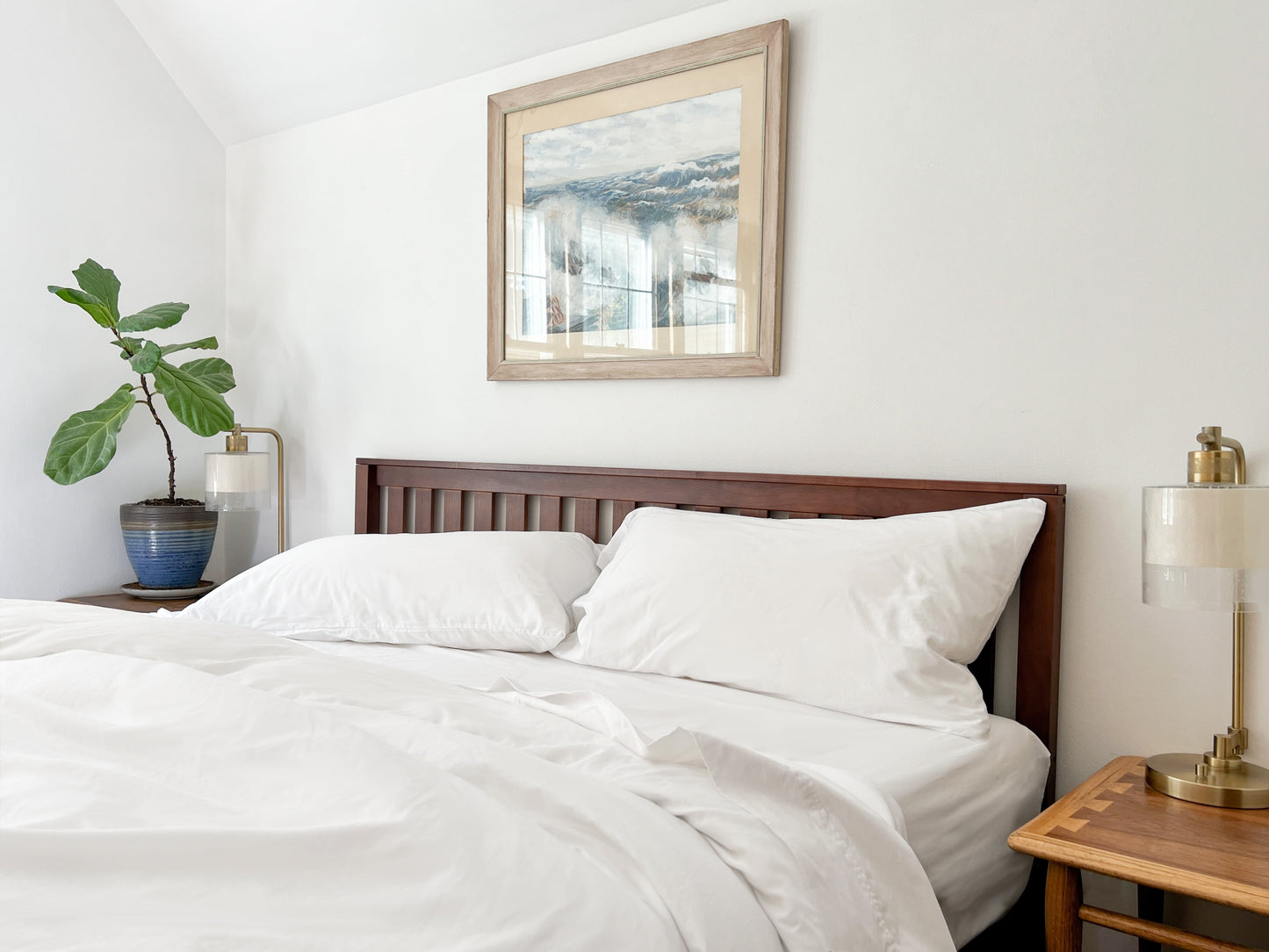 Organic percale bed sheets set, white duvet and pillowcases on bed