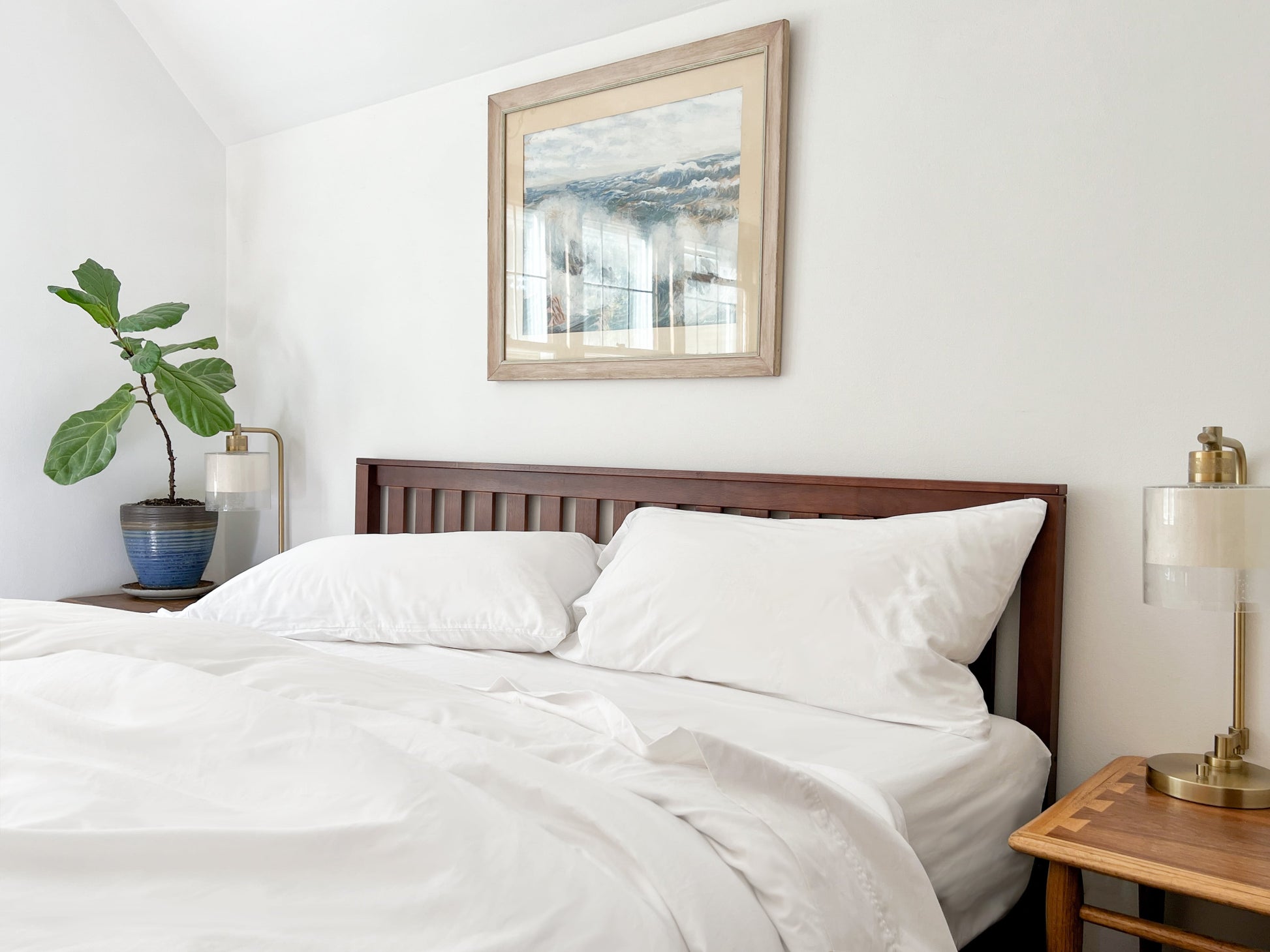 Organic percale bed sheets set, white duvet and pillowcases on bed