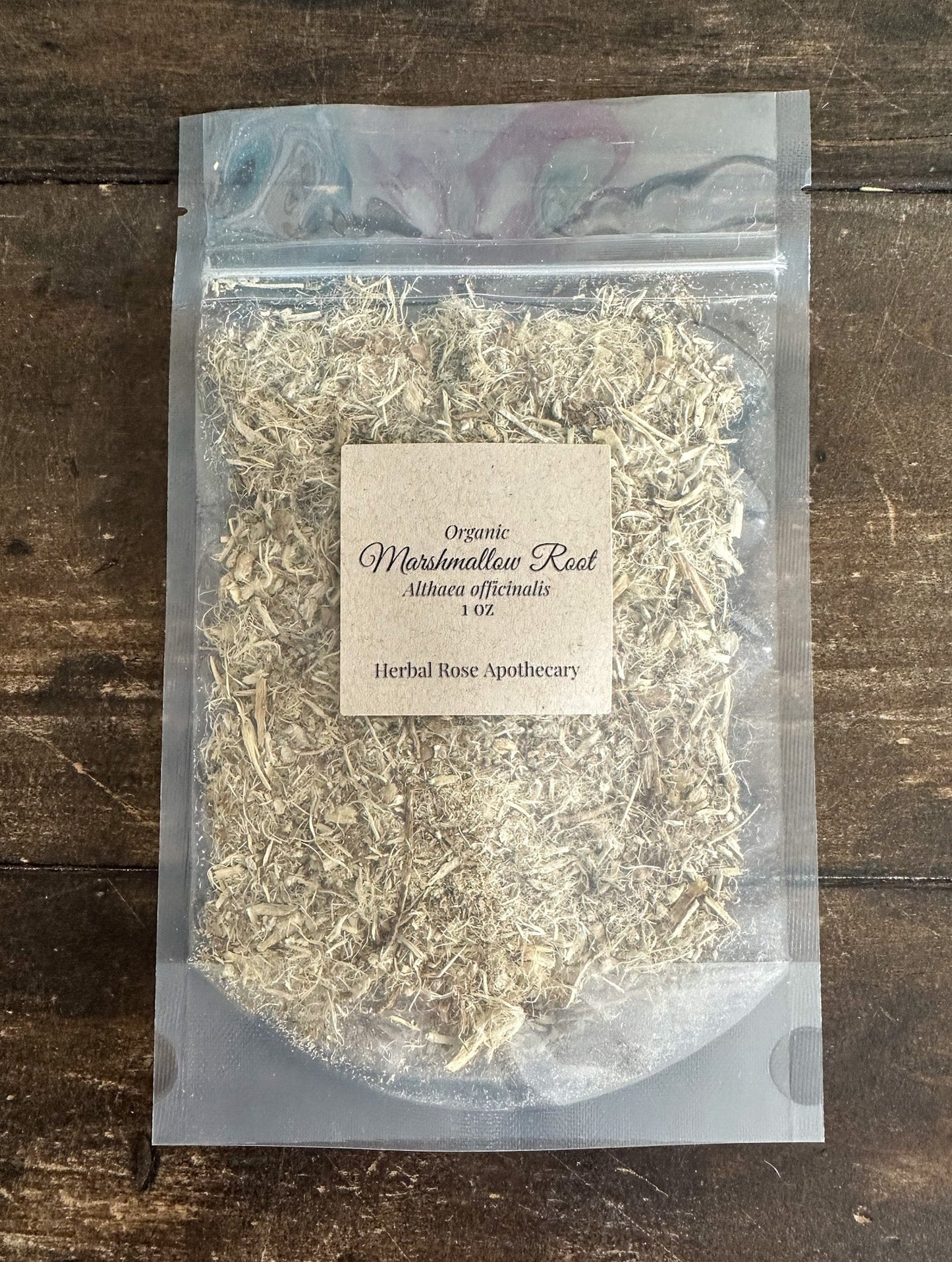 Marshmallow root herb in clear stand-up pouch, light tan shredded pieces