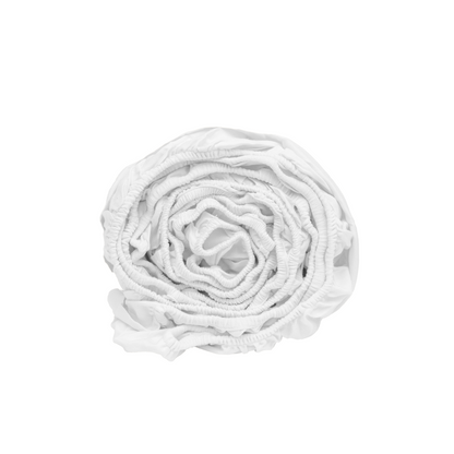 Organic sateen fitted sheet in white, neatly folded with gathered fabric texture