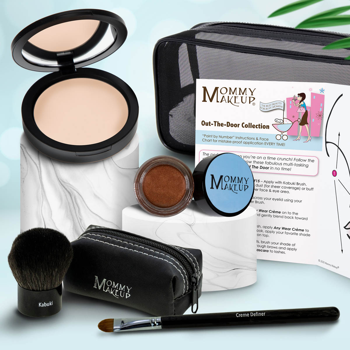 Travel makeup set with compact powder, cocoa brown cream jar, brush, black zip pouch, applicator