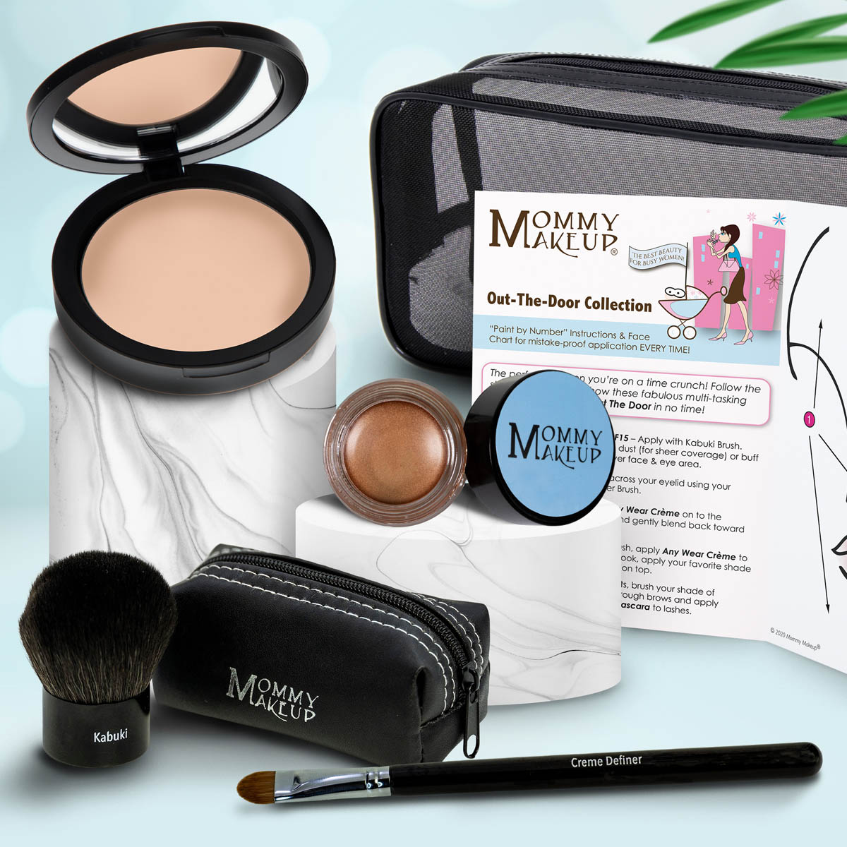 Makeup set with beige compact, bronze jar, makeup brush, black zip pouch, and applicator.