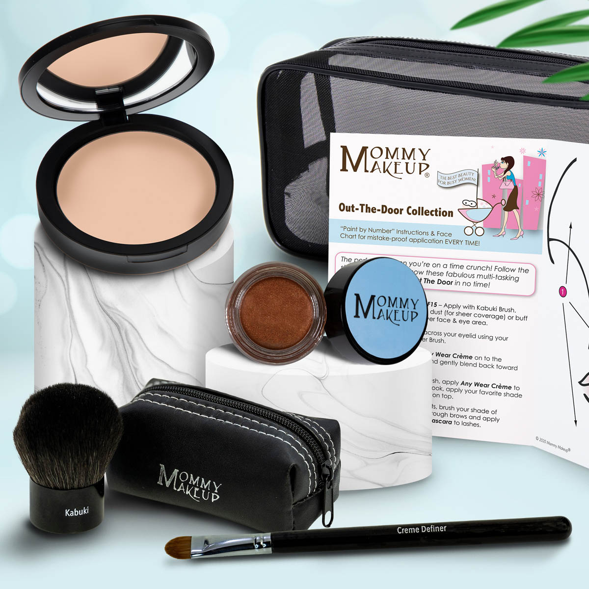 Makeup set with beige compact, bronze jar, makeup brush, black zip pouch, and applicator.