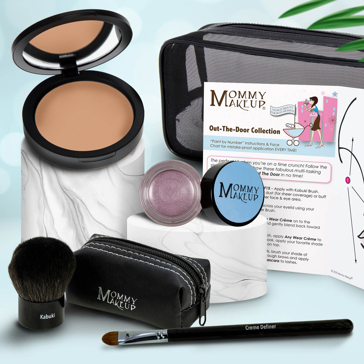 Travel makeup set with medium tan compact, lilac powder, brush, and zip case with pencil applicator