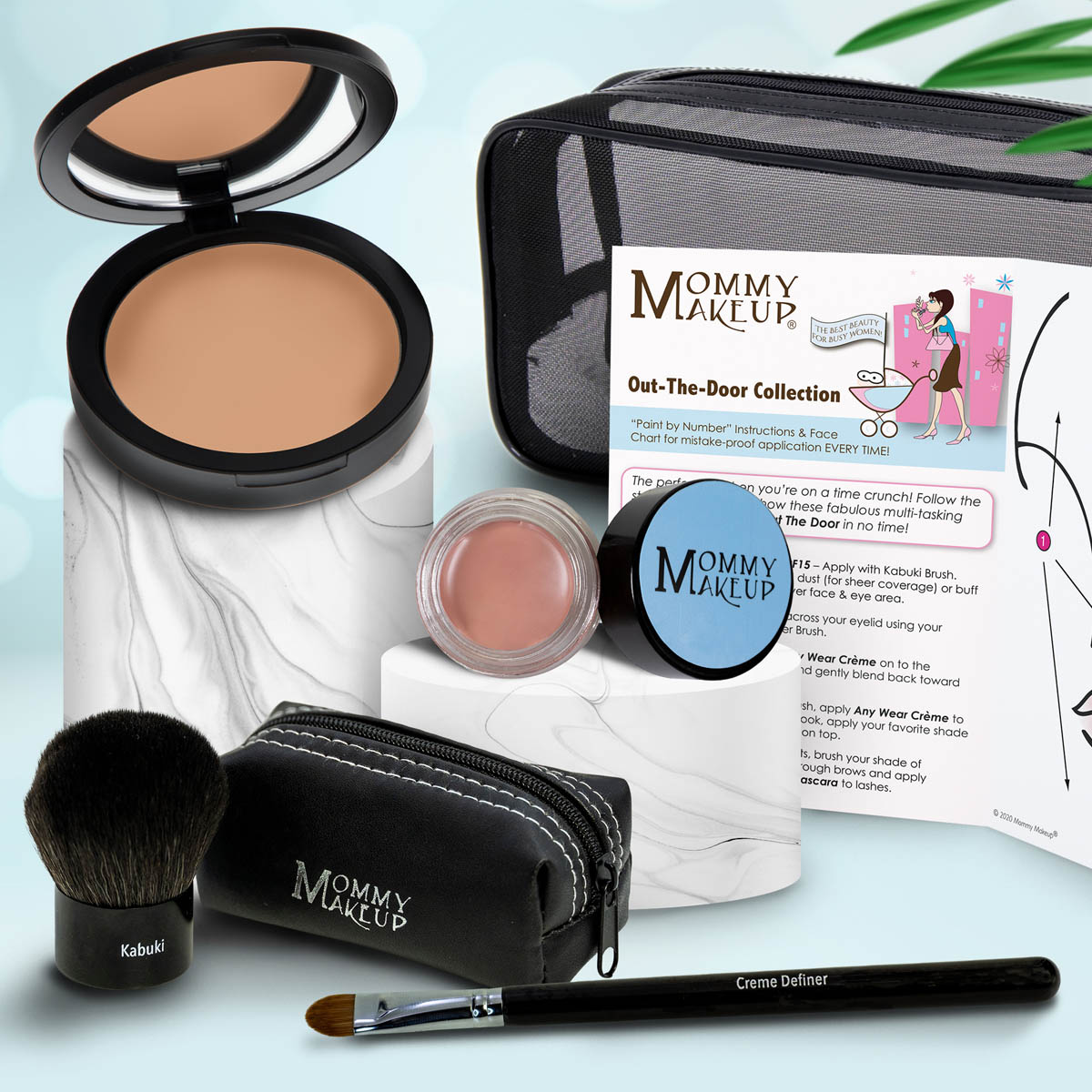 Travel makeup set with medium tan compact, soft pink powder, brush, and zip case with pencil applicator