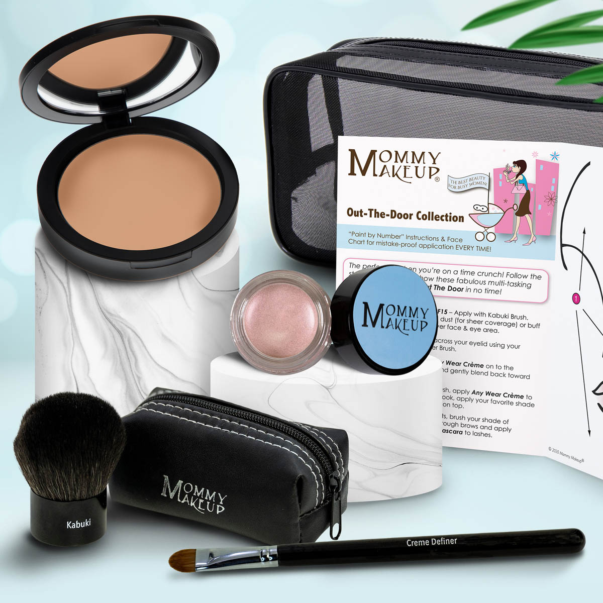 Travel makeup set with medium tan compact, pale pink powder, brush, and zip case with pencil applicator
