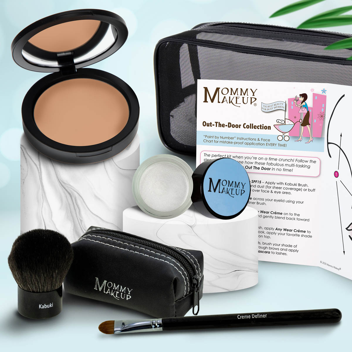 Makeup set with tan compact, off-white powder jar, makeup brush, and zip pouch