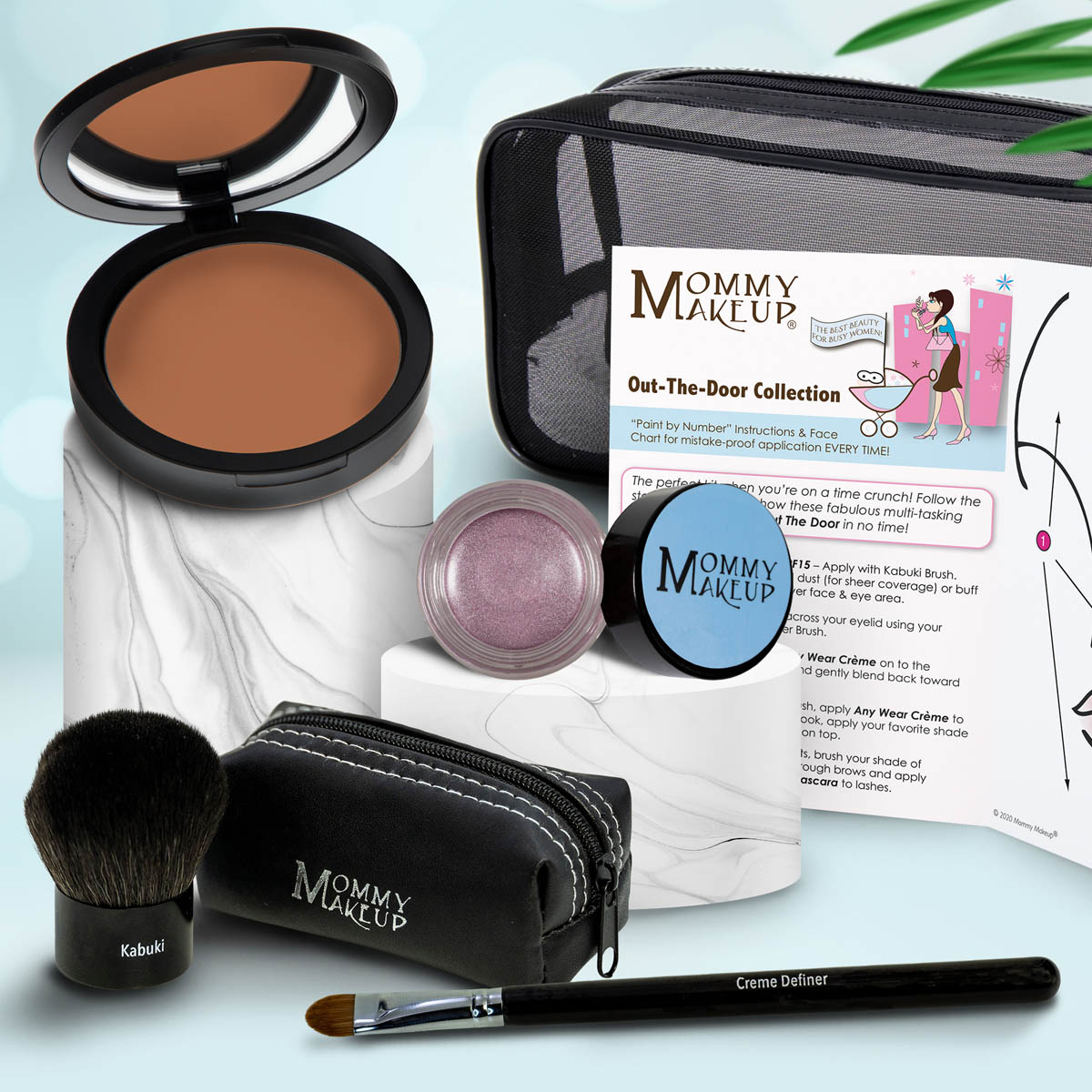 Makeup set with brown compact, mauve powder jar, makeup brush, and zip pouch