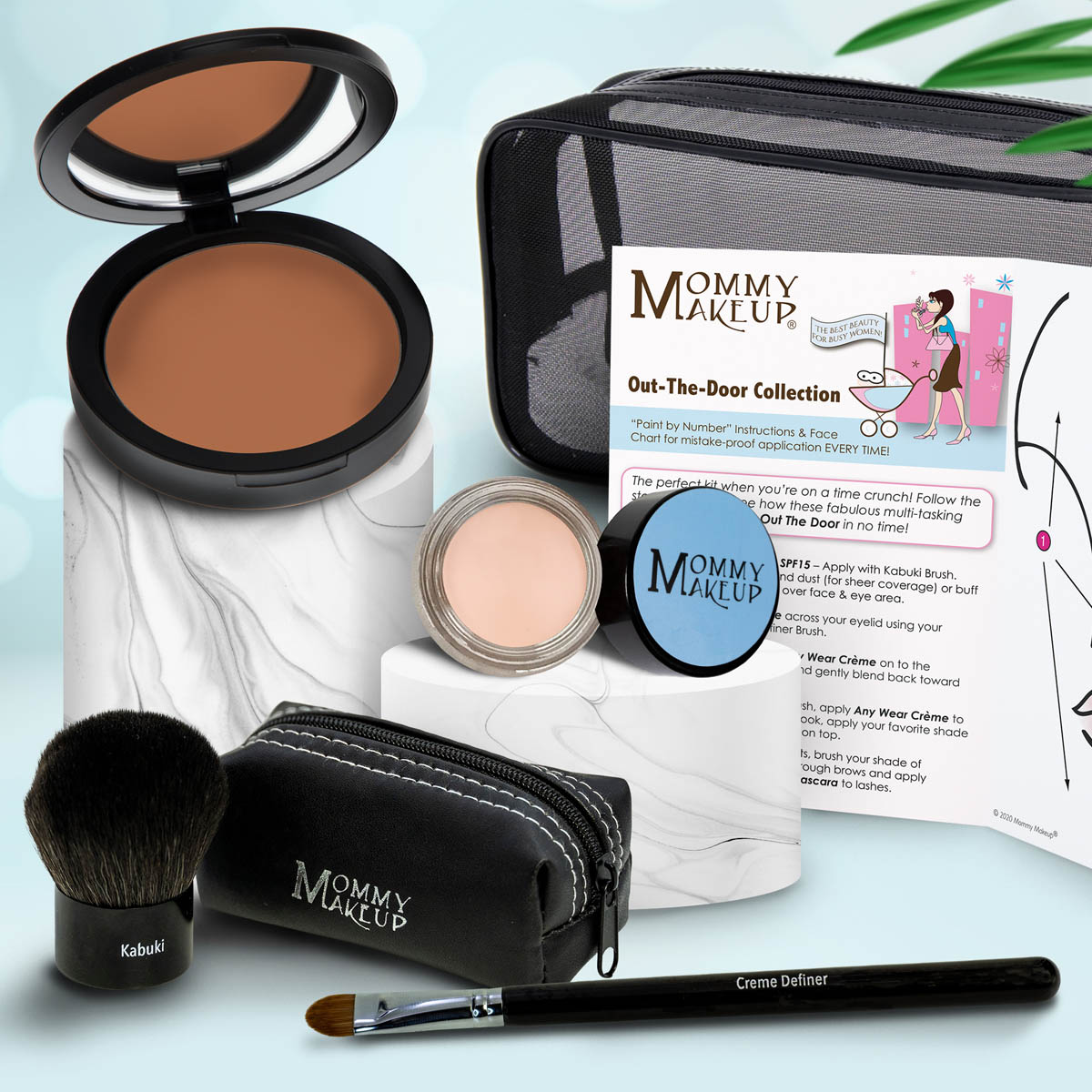 Makeup set with brown compact, light pink powder, kabuki brush, travel pouch