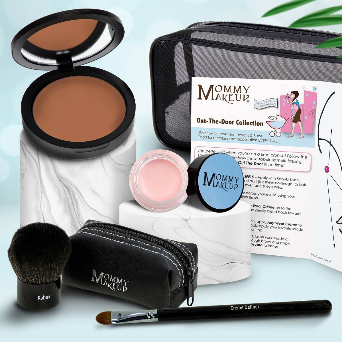 Makeup set with brown compact, pink shimmery powder, kabuki brush, travel pouch