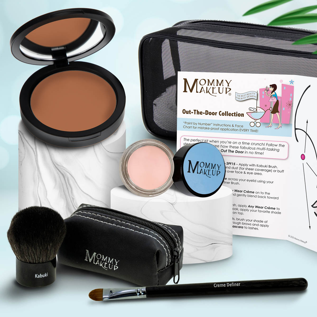 Travel makeup set with warm brown bronzer compact, pink cream, Kabuki brush, black zip case
