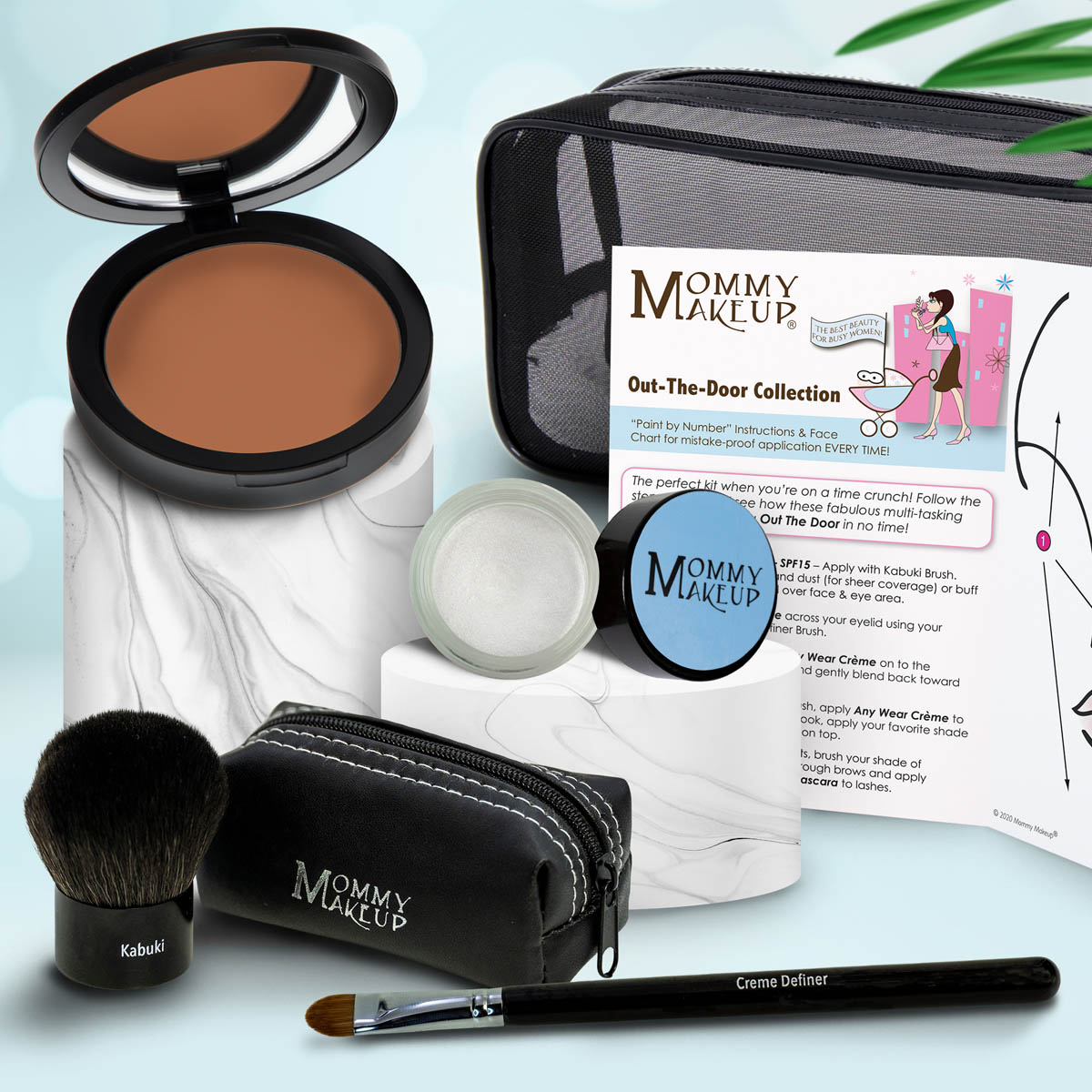 Travel makeup set with brown bronzer compact, pale white cream, Kabuki brush, black zip case