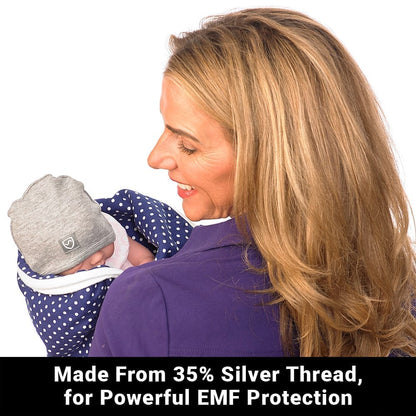 Gray baby beanie with shield logo patch, worn by infant