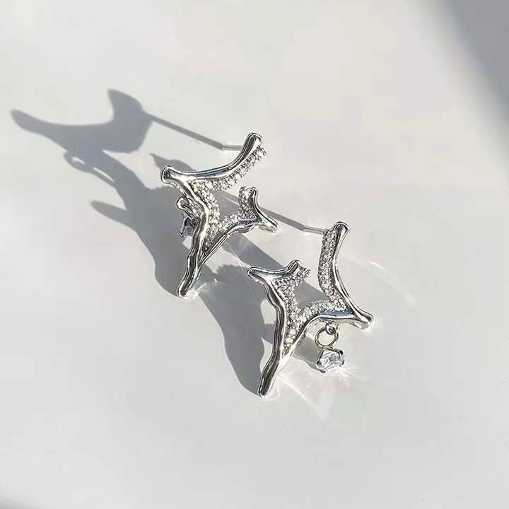 Silver rhinestone star cross earrings pair, dangling front view