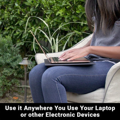 Black laptop pad in use on a couch with a laptop resting on top.
