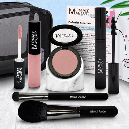 Makeup set with eyeshadow compact, rose-pink lip color tube, and two black brushes
