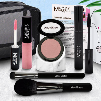 Makeup set with eyeshadow compact, bright pink lip color tube, and two black brushes