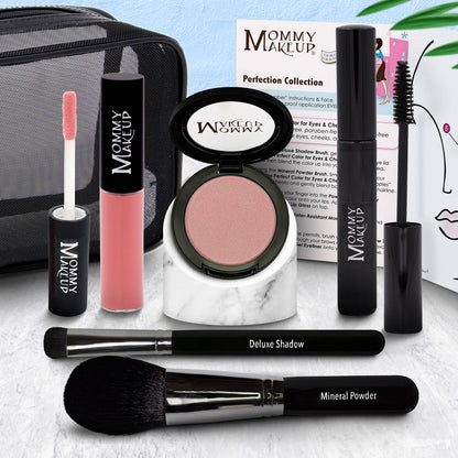 Makeup set with eyeshadow compact, pink-coral lip color tube, and two black brushes