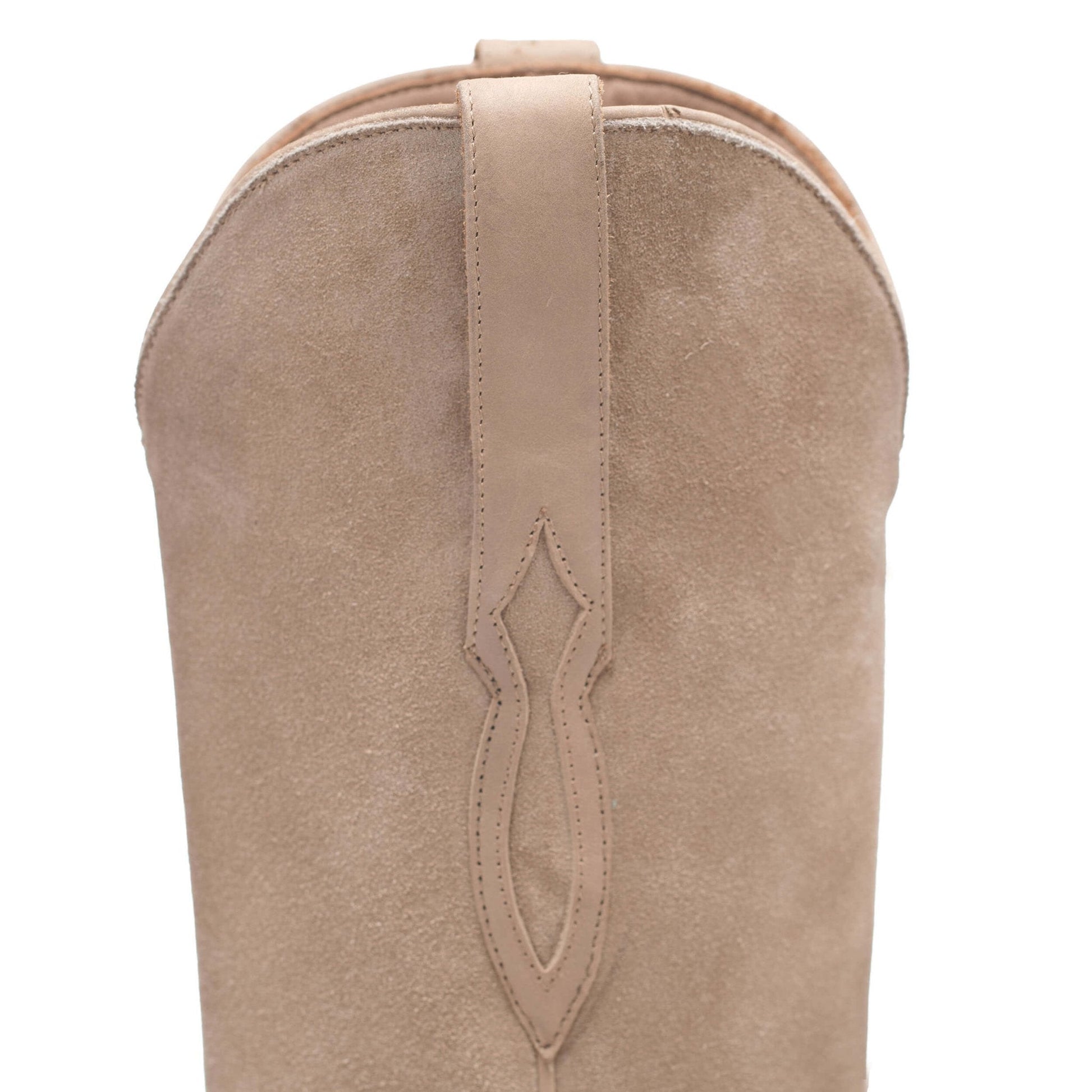 Taupe suede boot shaft with V-shaped seam detail and rounded top opening.