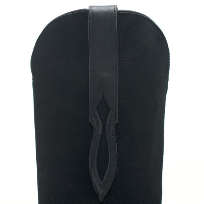 Black leather cowboy boot shaft close-up with V-shaped vent cutout