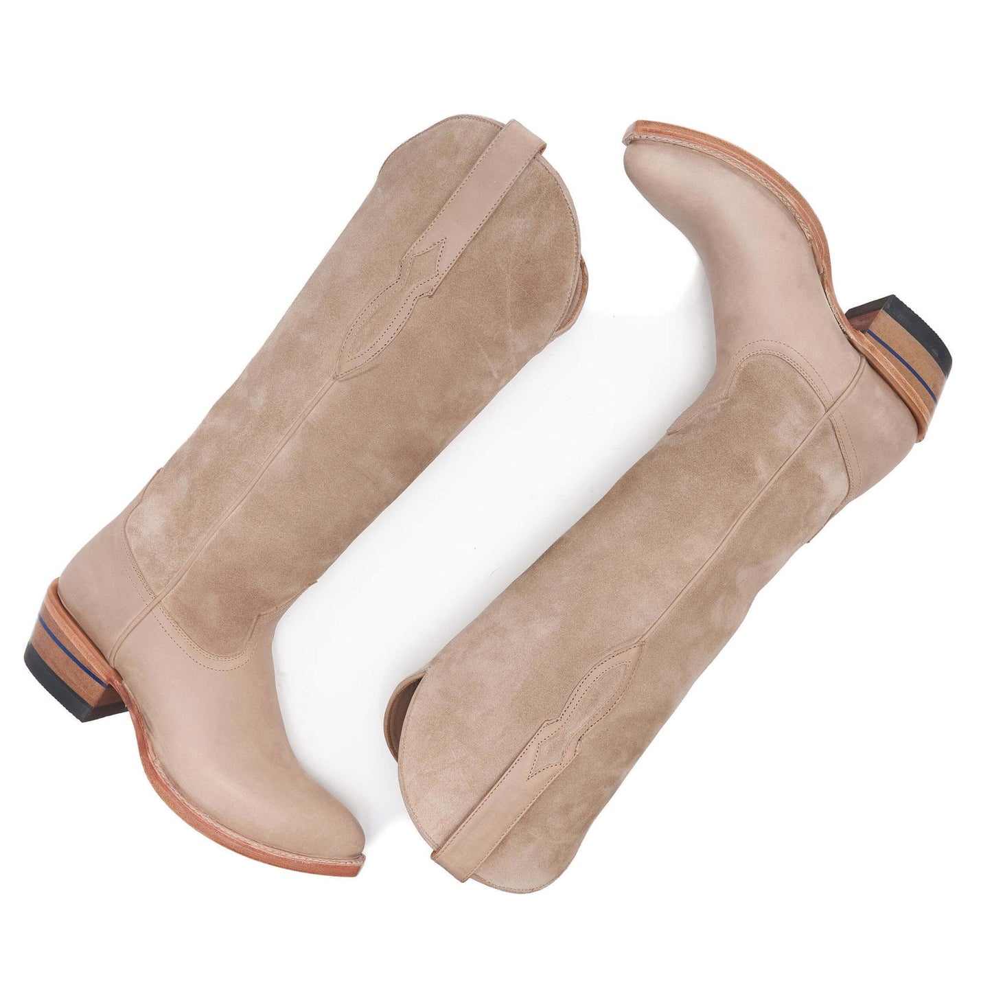 Pair of tan suede cowboy boots with almond toe and block heel