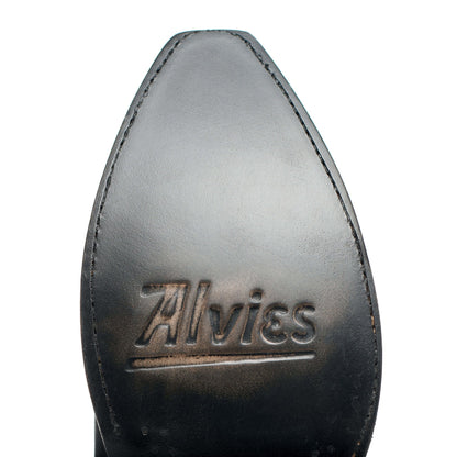 Cowboy boot toe with Alvies logo, dark leather and edge stitching