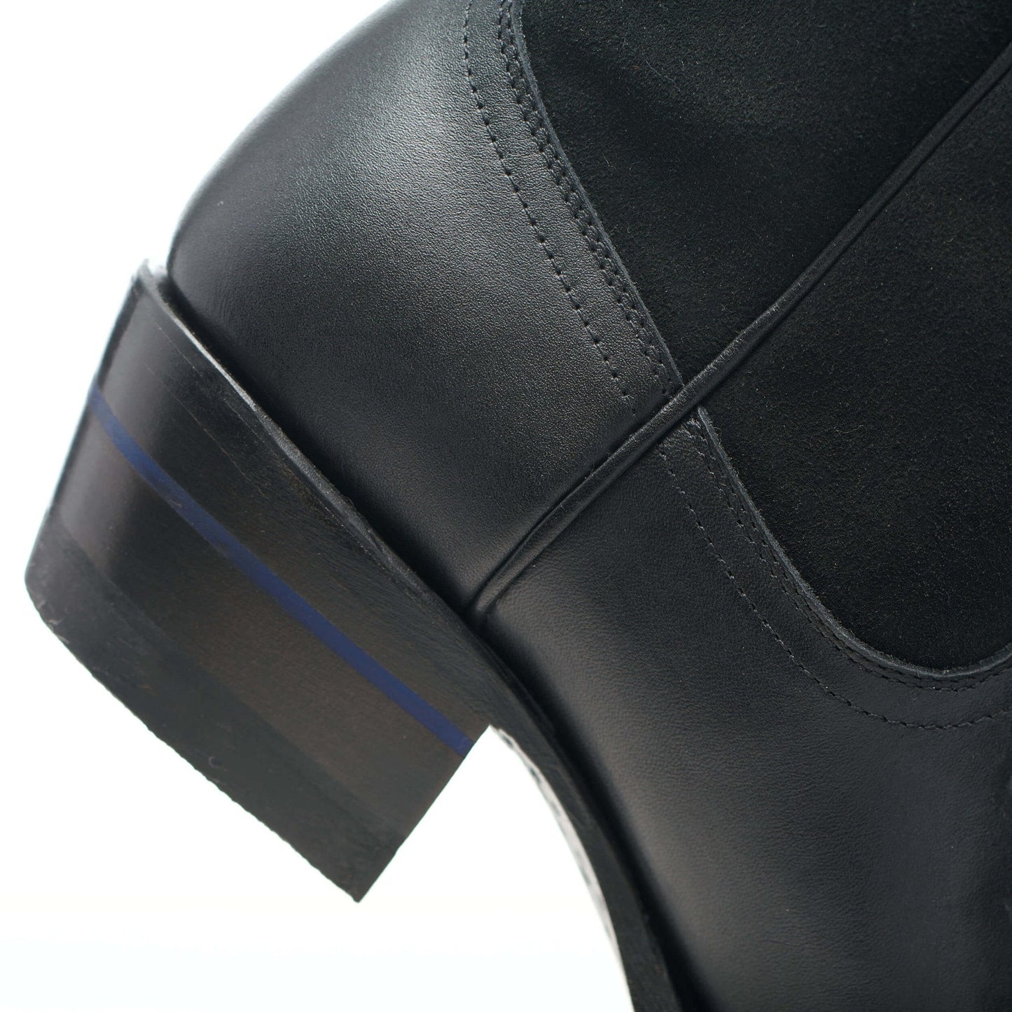 Black leather cowboy boot with stacked heel and angled side panel stitching