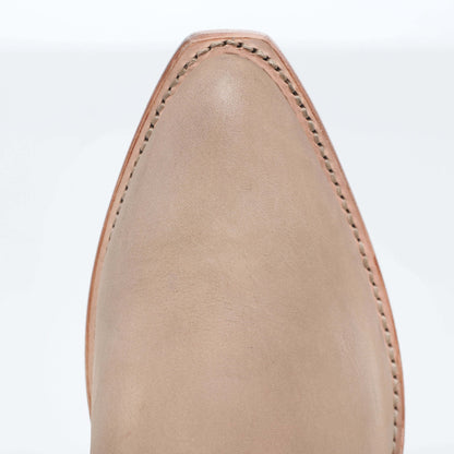 Tan suede boot upper with curved top and neat stitched seams