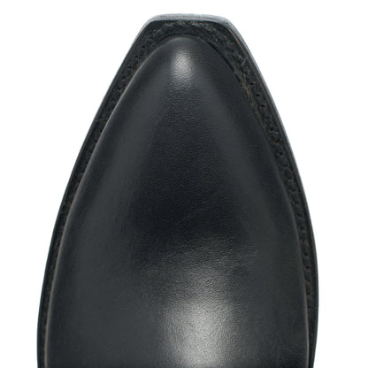 Black leather cowboy boot upper, close-up of rounded toe and stitching