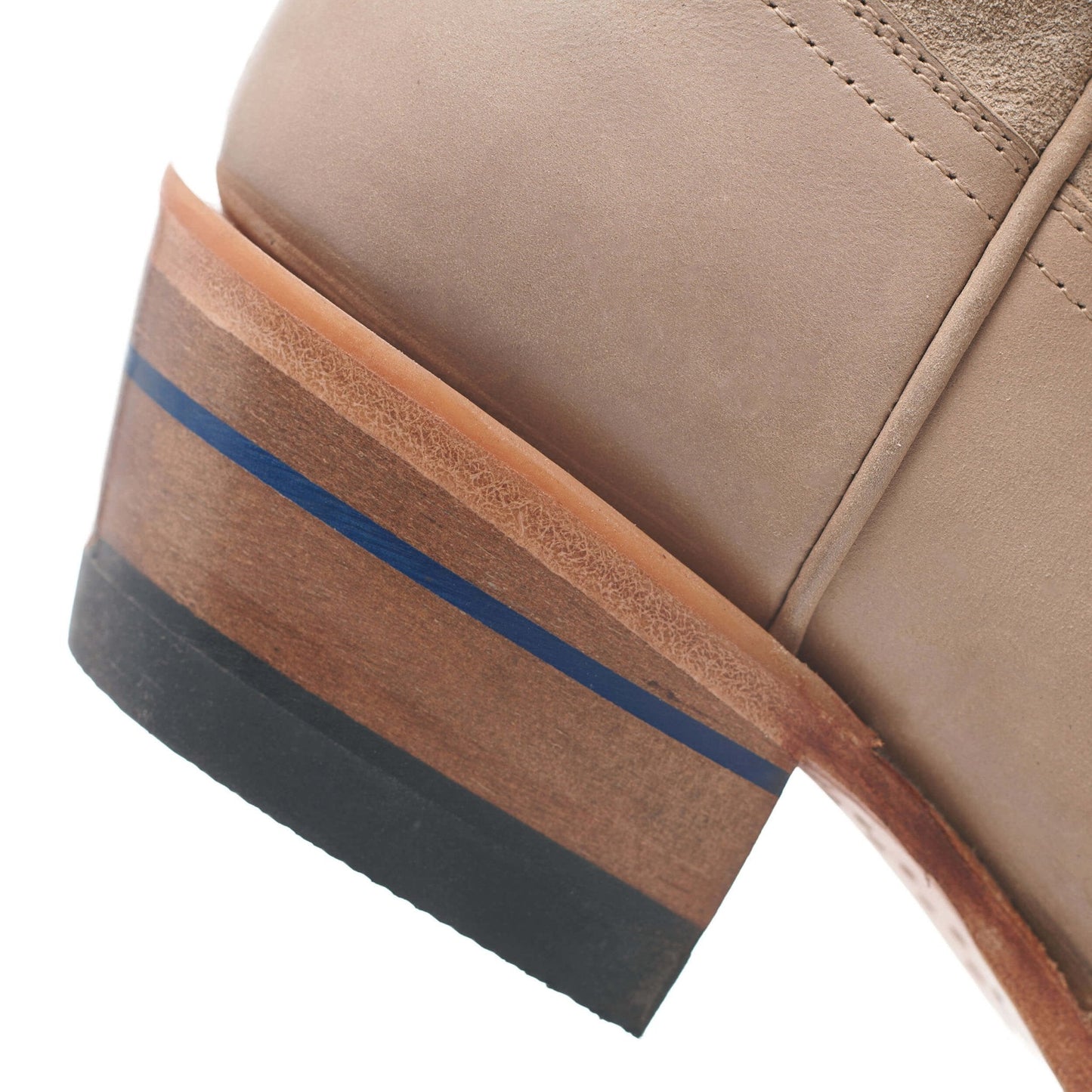 Tan boot heel detail with blue stripe accent and stacked sole