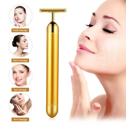 24K gold facial roller massager with T-shaped head, used on face