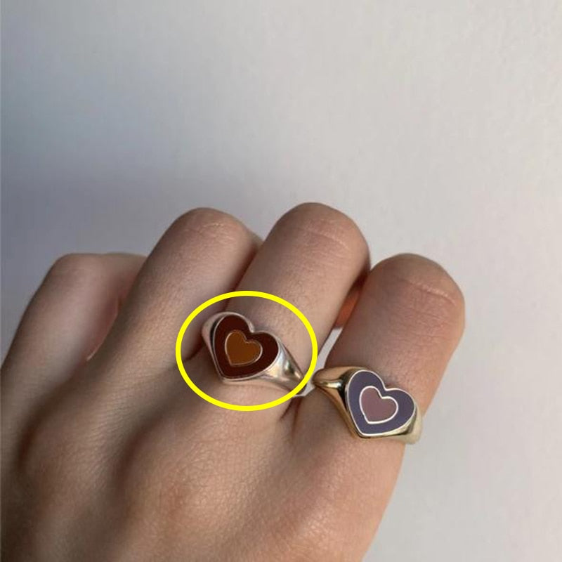 Love heart ring close-up with dark brown heart enamel on silver-tone band