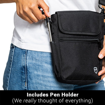Black phone pouch with flap and front zipper pocket held near jeans