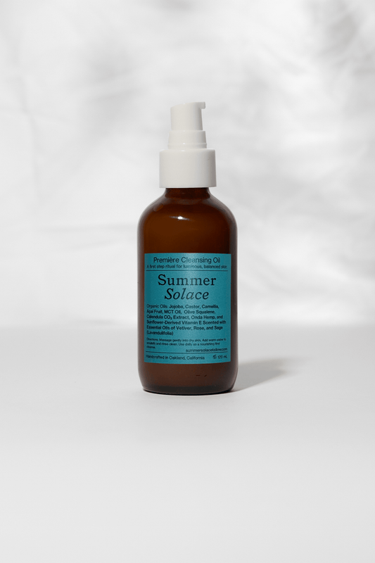 Cleansing oil bottle with amber pump, labeled Première Cleansing Oil Summer Solace