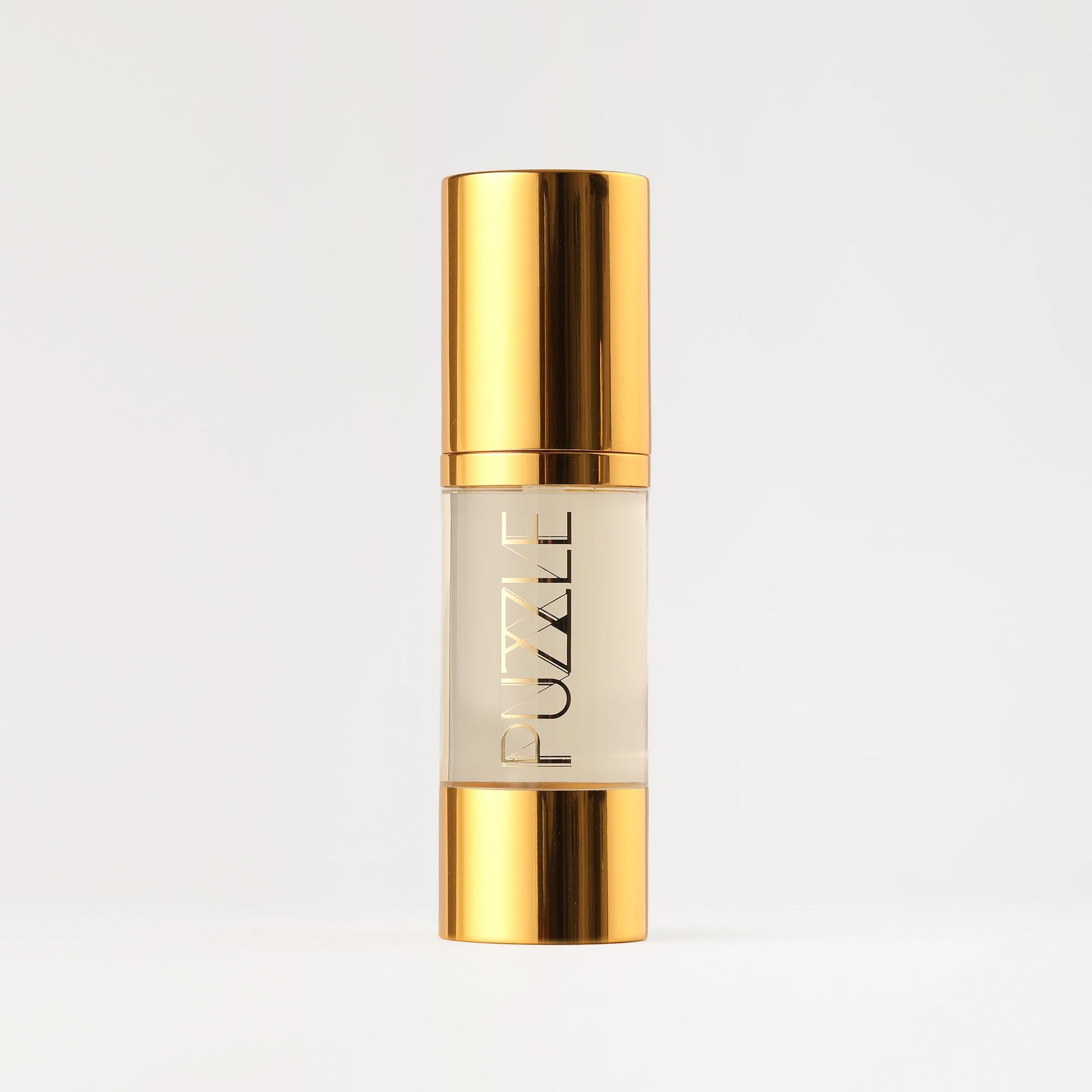 Makeup remover bottle with gold cap and clear liquid tube