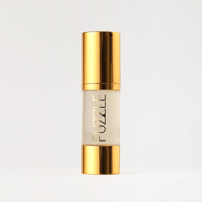 Makeup remover bottle with gold cap and clear liquid tube