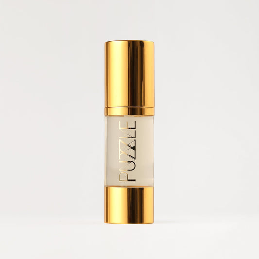 Makeup remover bottle with gold cap and clear liquid tube