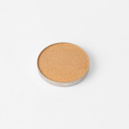 Pressed eyeshadow pan, copper bronze shimmer